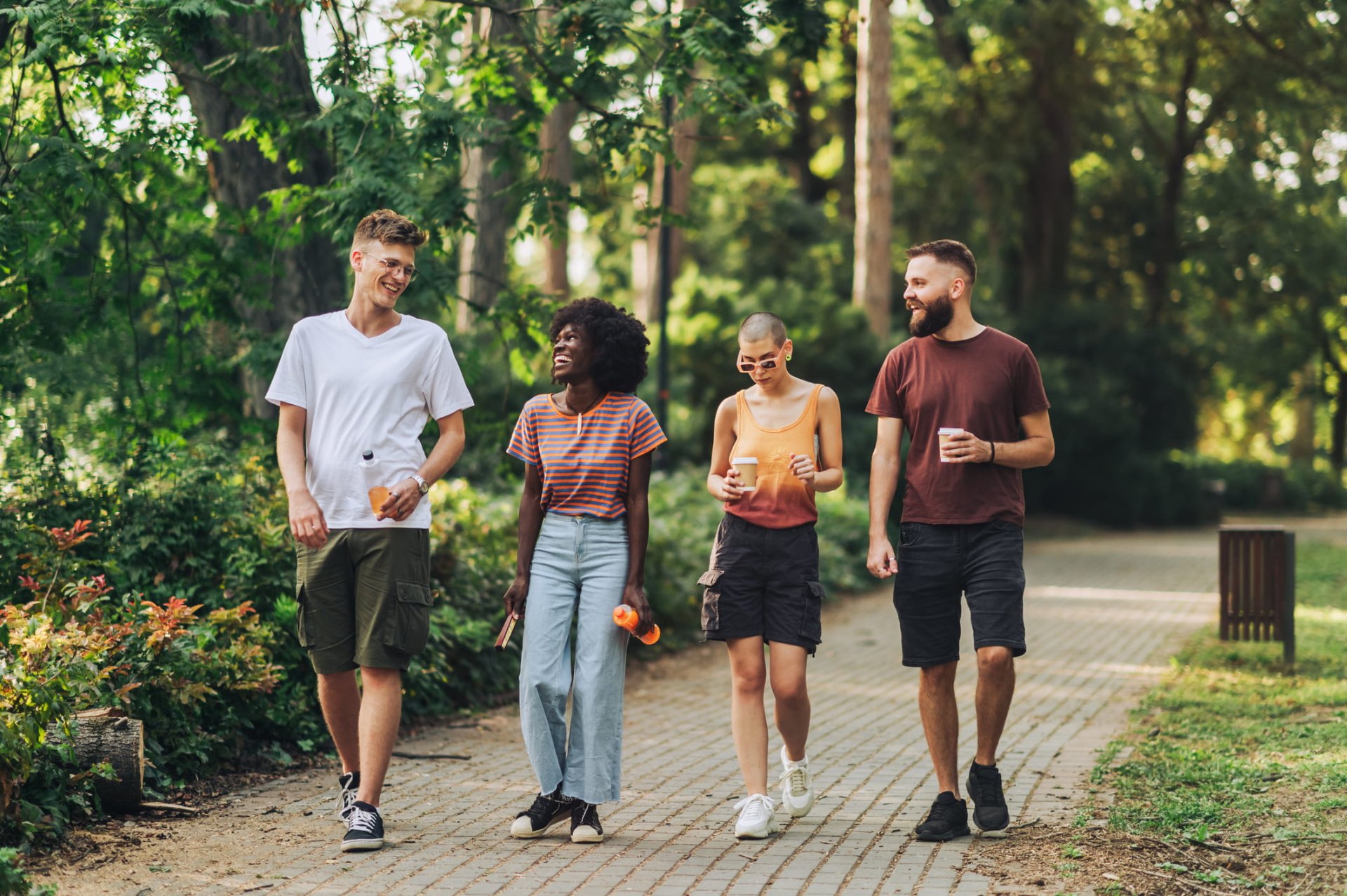 Group of friends walking together in a park