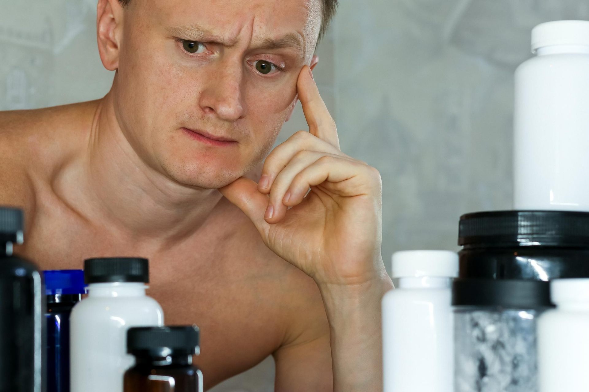 Phone screen showing flashy fitness marketing next to a simple notepad representing marketing versus science