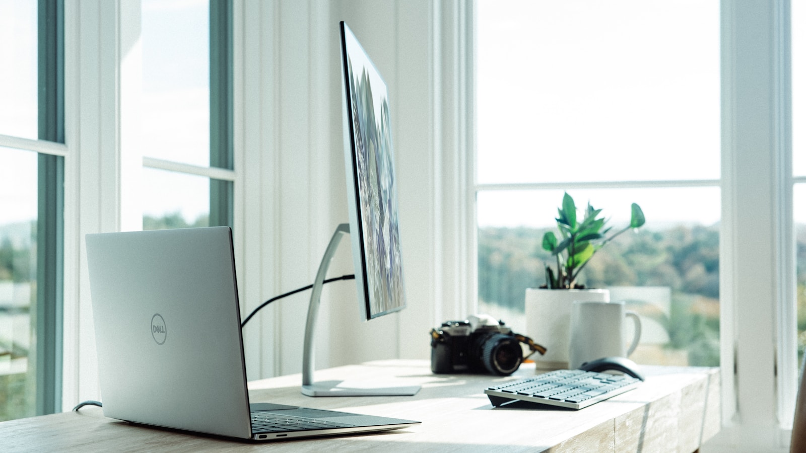 Person working at a standing desk in modern office