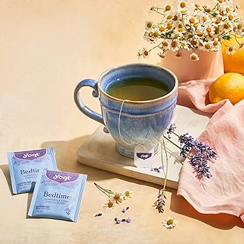 Yogi Bedtime tea bags with chamomile flowers and a cup of tea