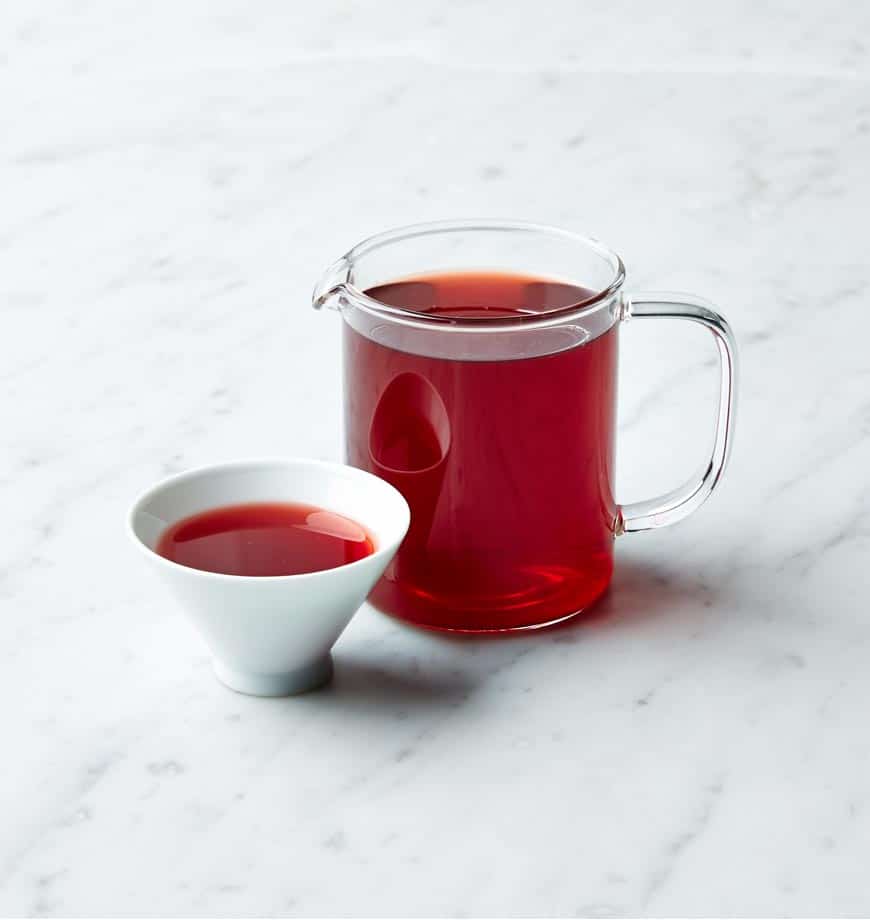 Glass pitcher of deep red hibiscus tea