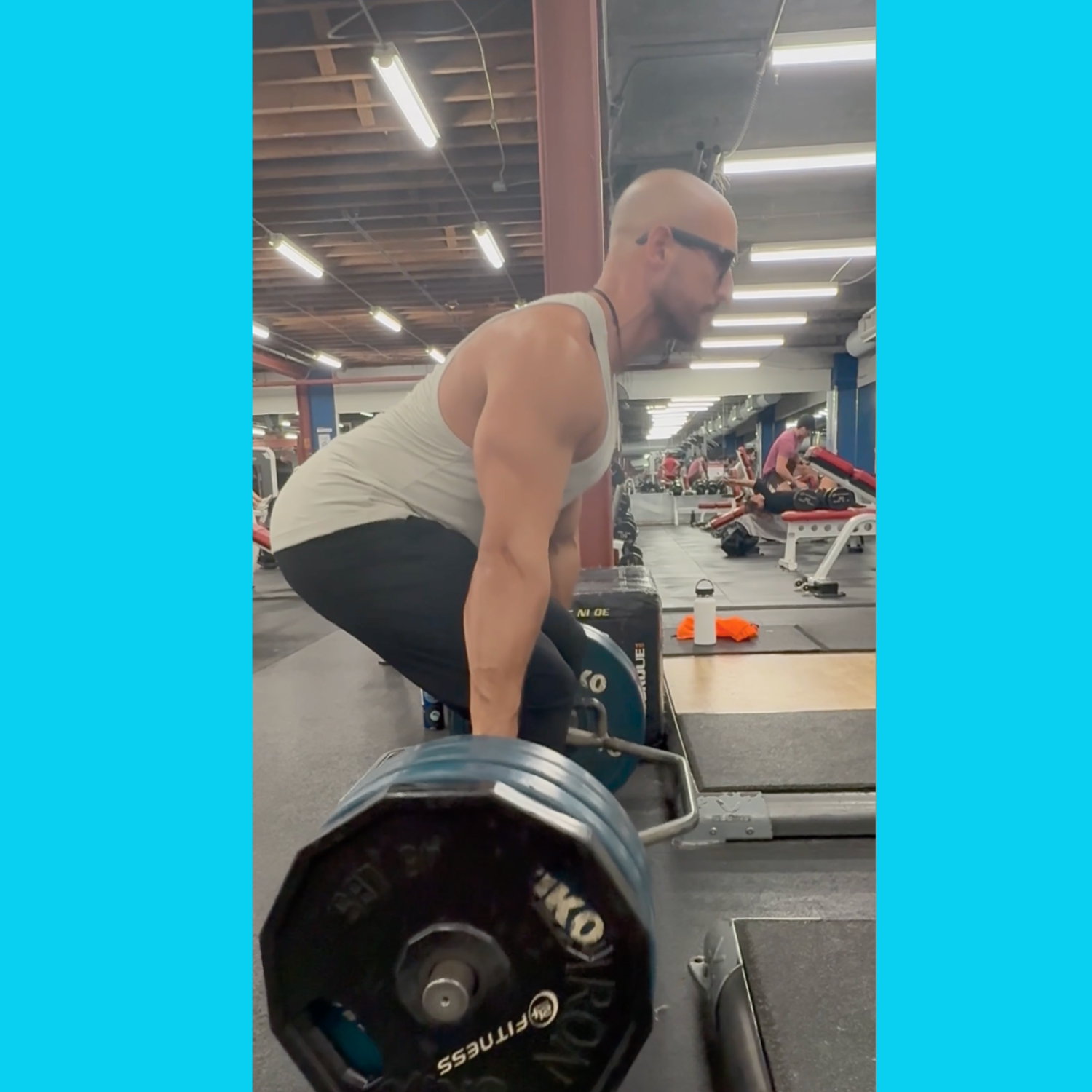 Franco performing a deadlift with proper form in the gym